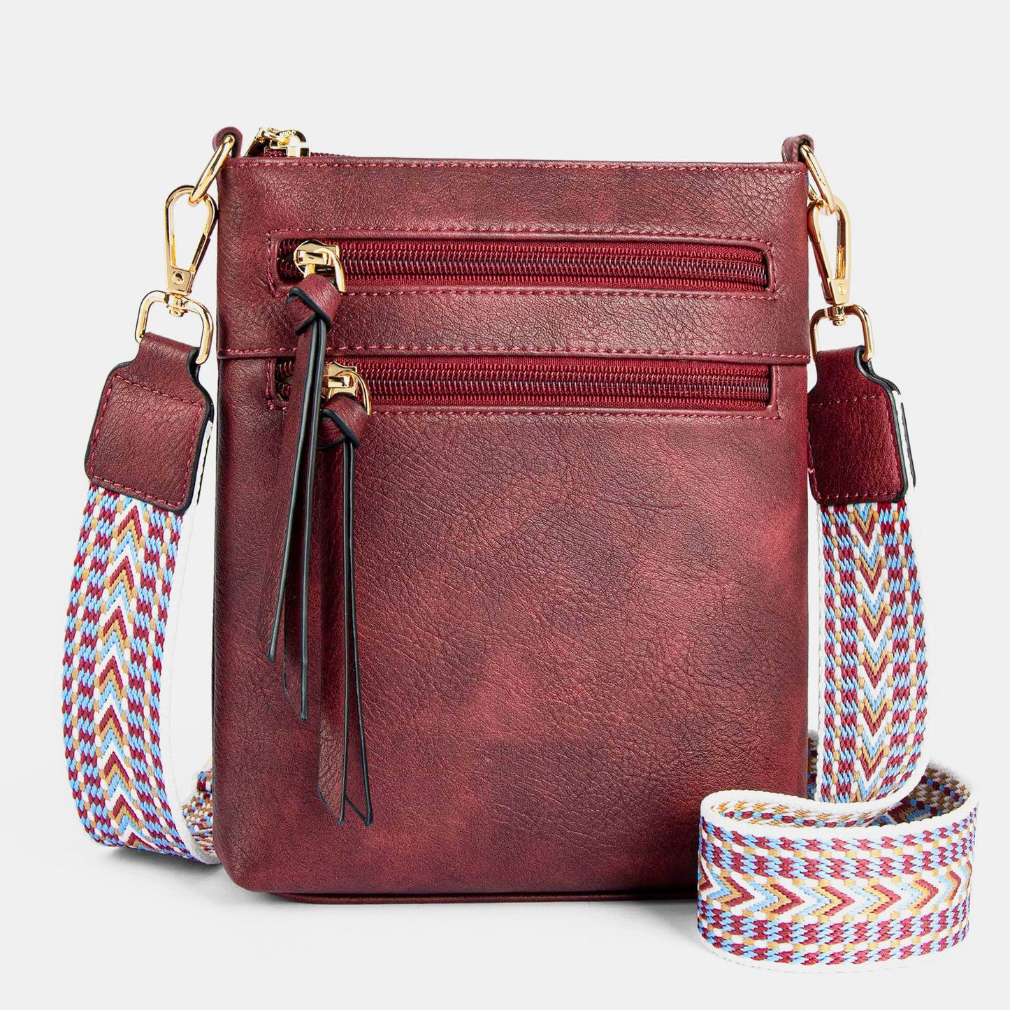 Sac bandoulière vertical pour femme avec plusieurs poches zippées.